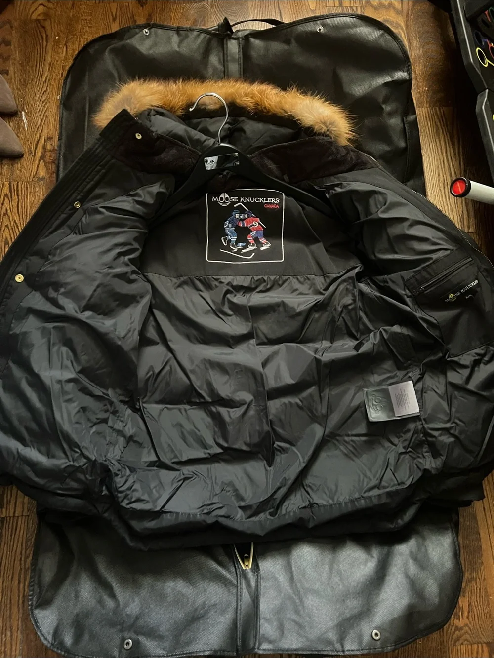 Moose Knuckles Black Winter Jacket with Gold Fur Trim And Accents